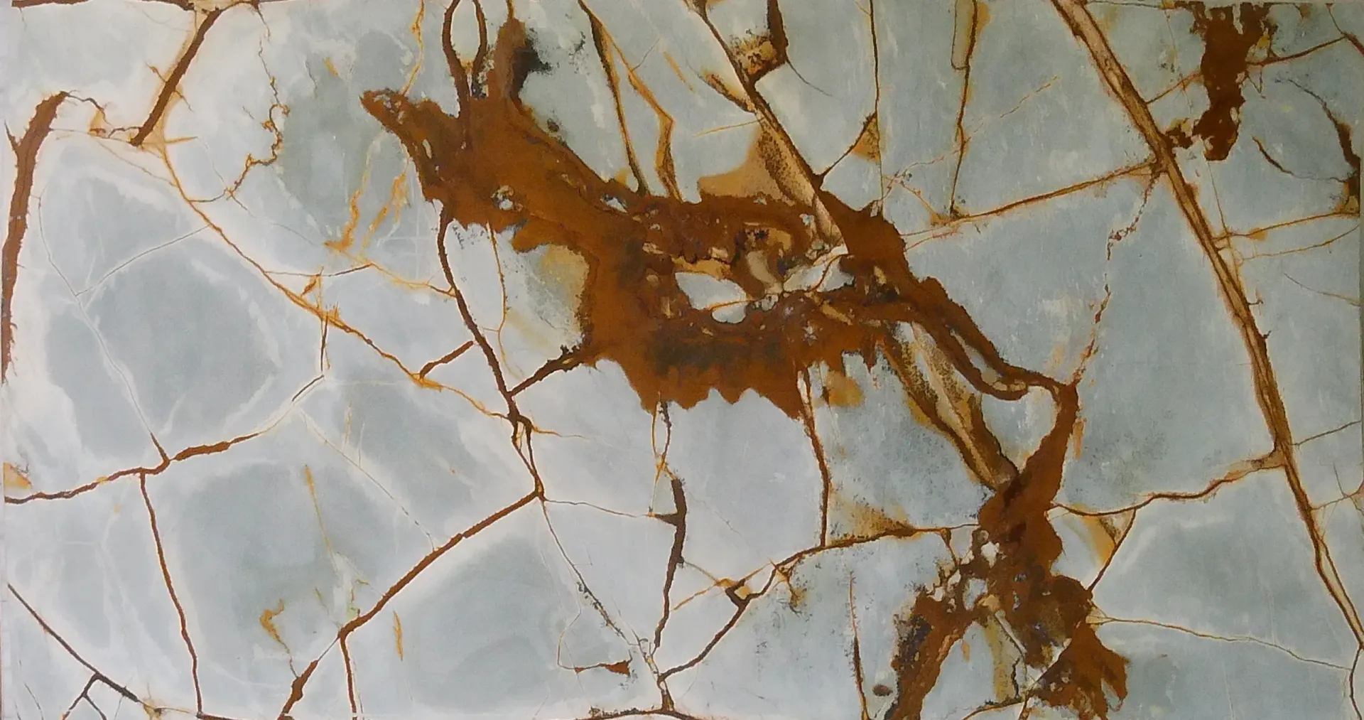 A close up of a piece of marble with a brown stain on it