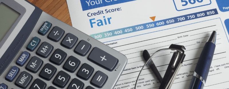 Calculator, credit report showing a