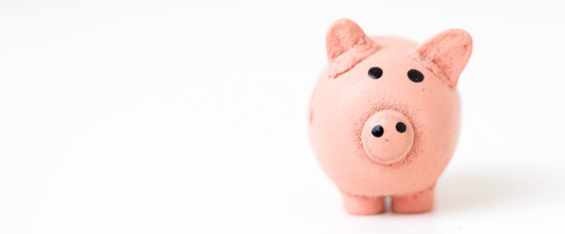 A pink piggy bank on a white background.