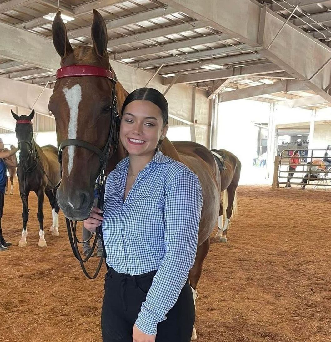 photo of Lenux Stables academy rider on horse, with instructor after leaving ring in horse show competition