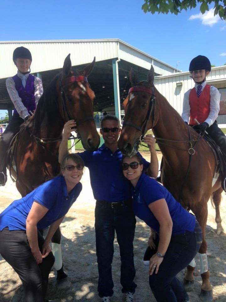 photo of two academy riders on American Saddlebred horses at a horse show with instructors