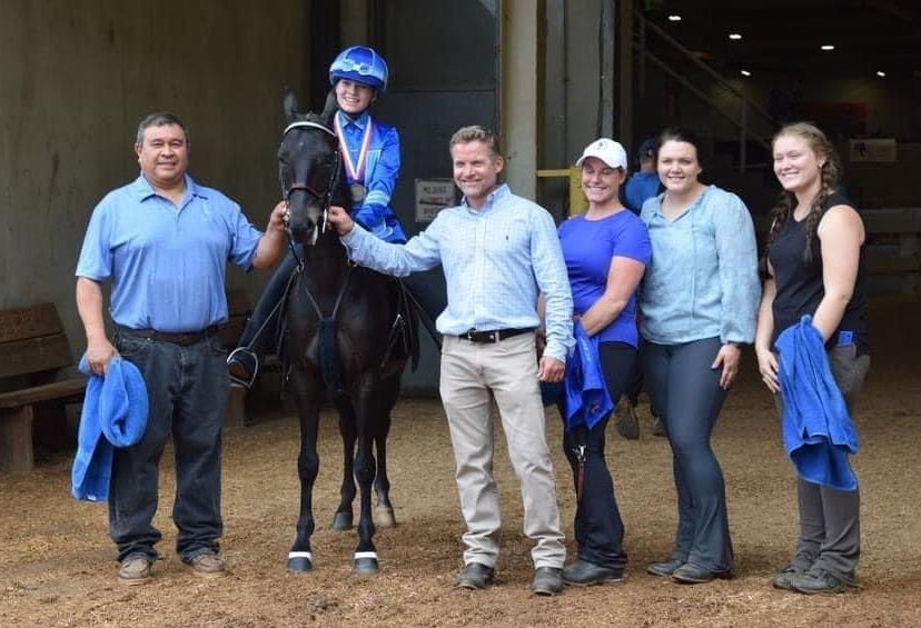 photo of Lenux Stables staff and rider on a Hackney Roadster Pony after winning horse show competition