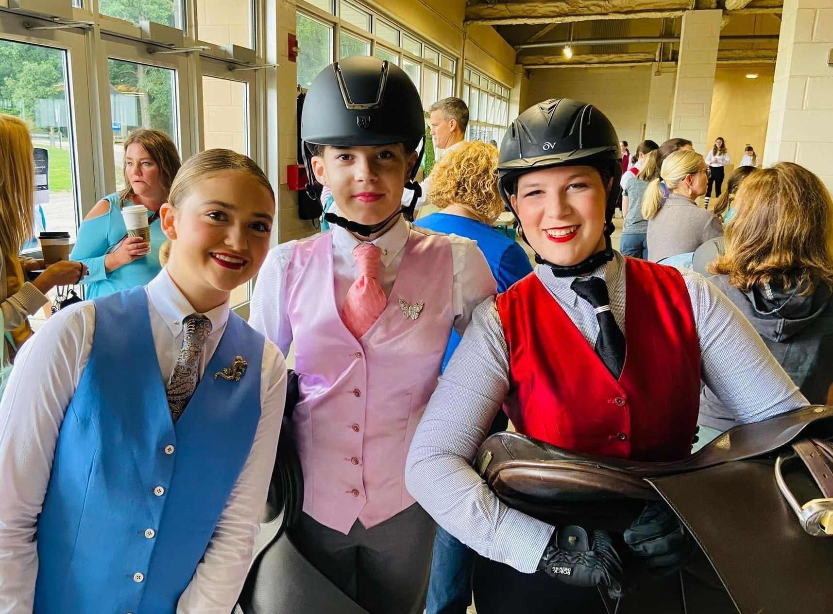 photo of three smiling Lenux Stables riders at horse show