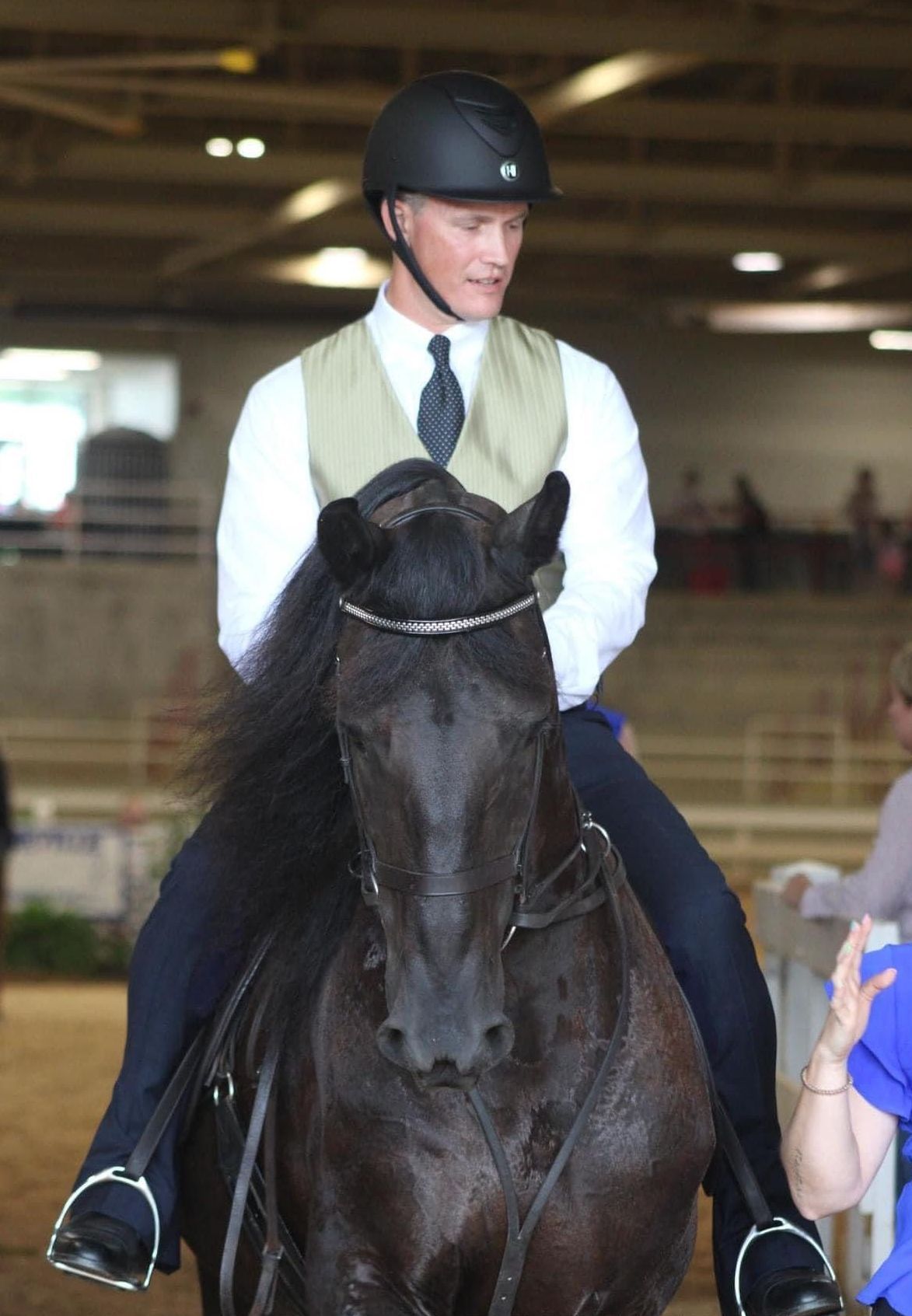 photo of Lenux Stables rider sitting on horse in horse show competition
