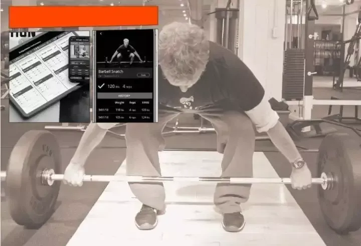 Haltérophile en plein soulevé de terre dans une salle de sport, avec une petite capture d’écran de téléphone en haut à gauche.