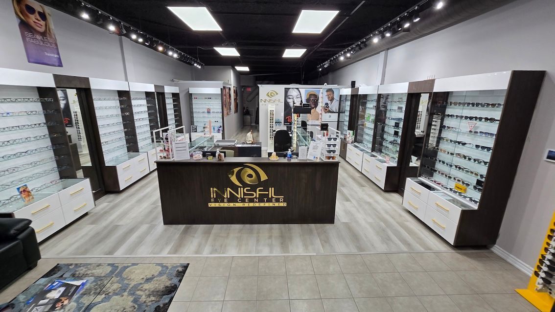 A large optical store with a large counter in the middle of the room.