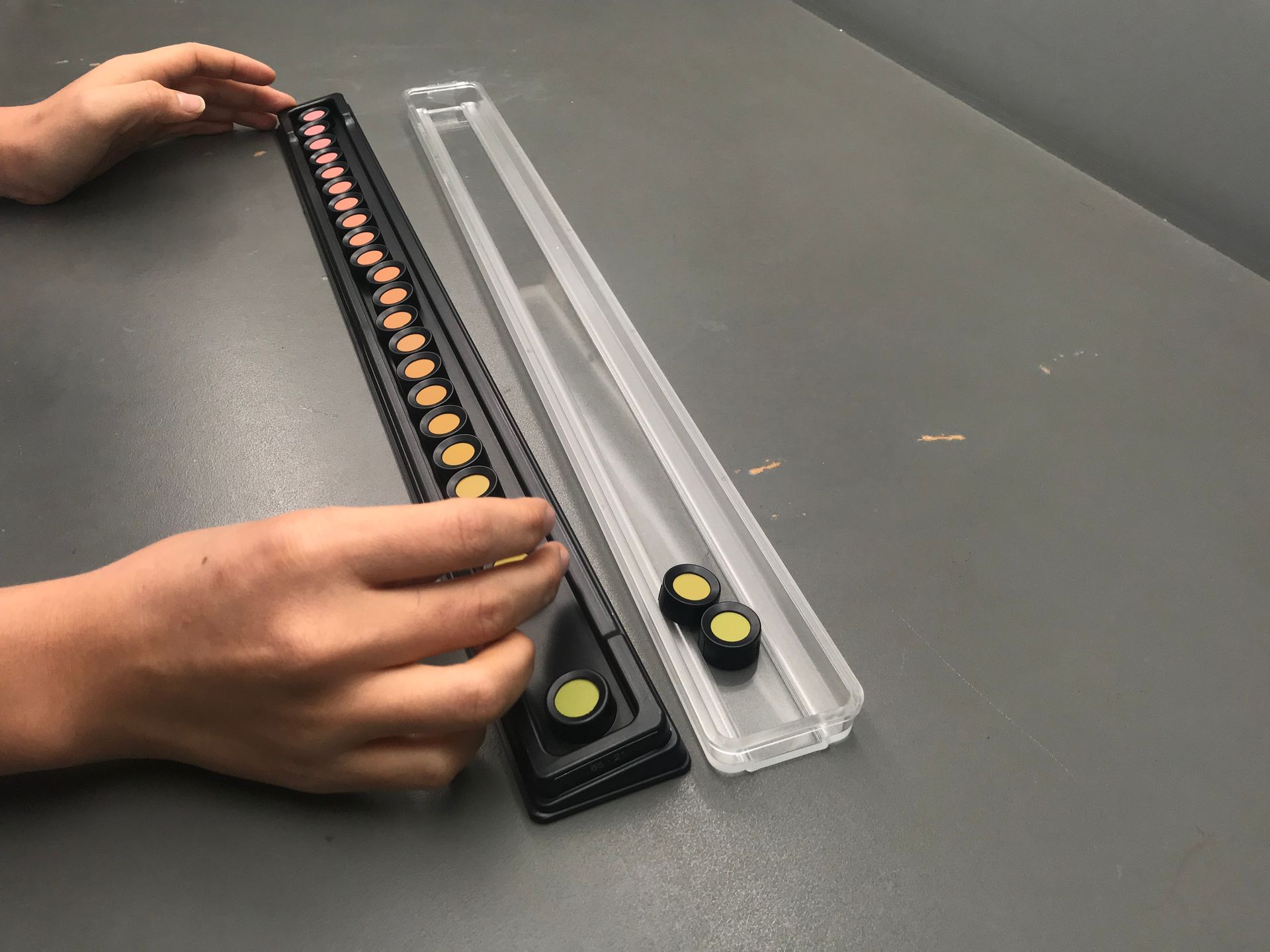 A person is playing with a toy on a table