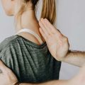 Physical therapy massage on a woman’s neck and shoulder