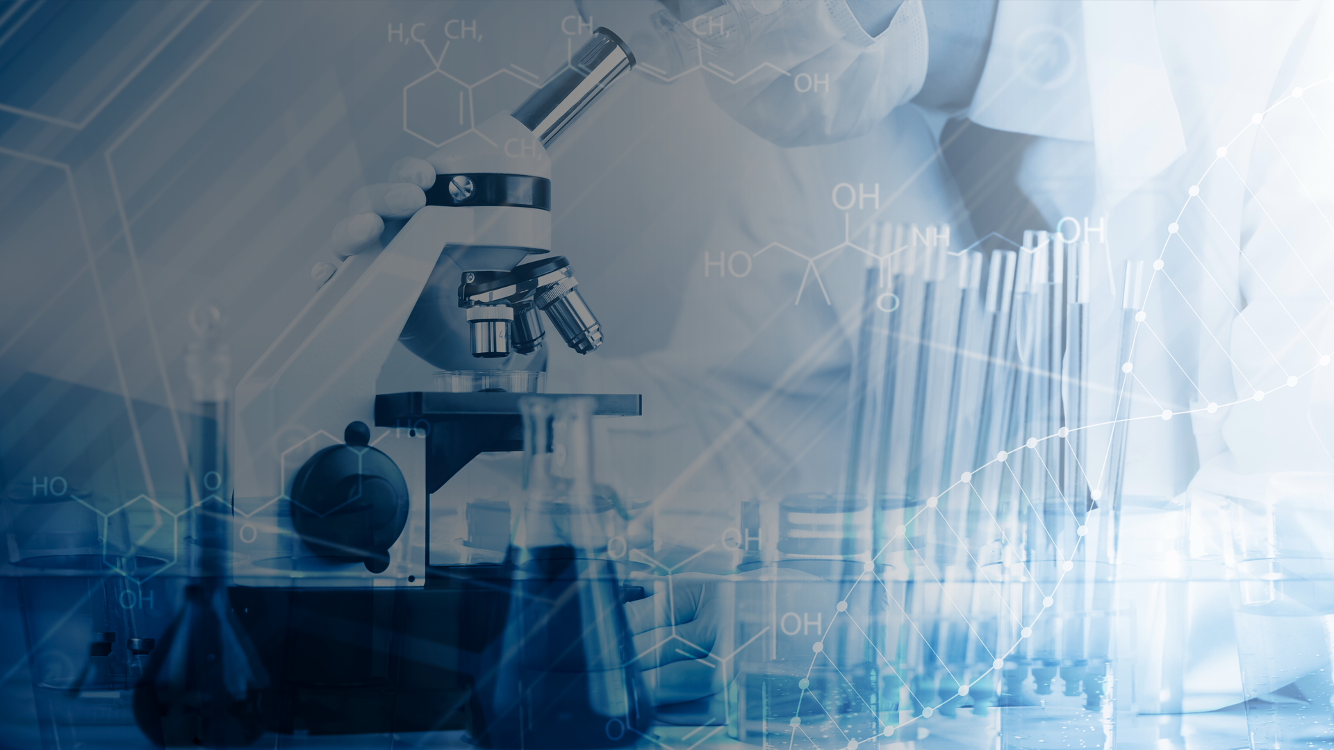 A scientist is looking through a microscope in a laboratory.