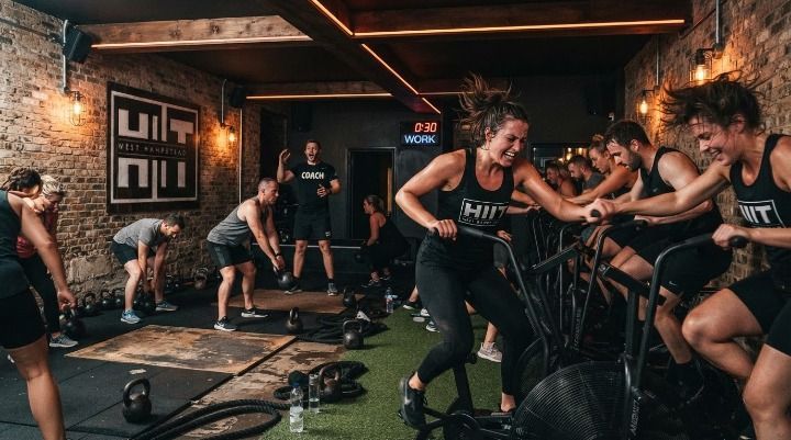 HIIT class in progress at HIIT West Hampstead, members training on assault bikes and kettlebells