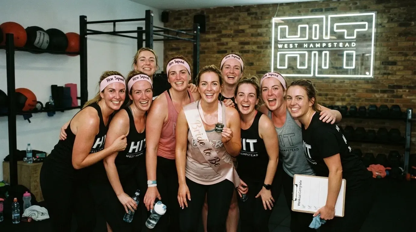 Hen party bride-to-be and friends posing for a group photo after a fitness class challenge