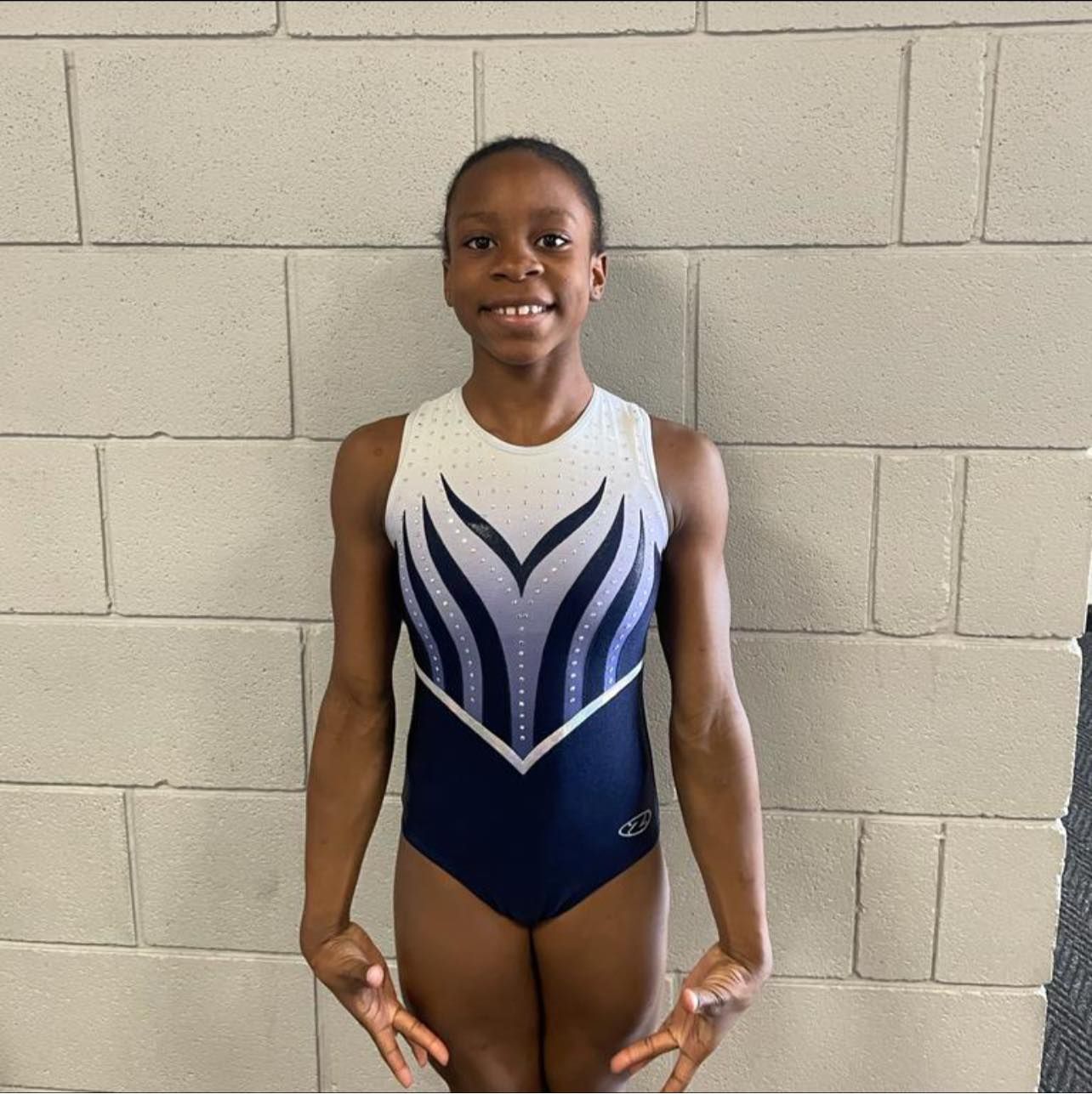 Gymnasts smiling after their competition