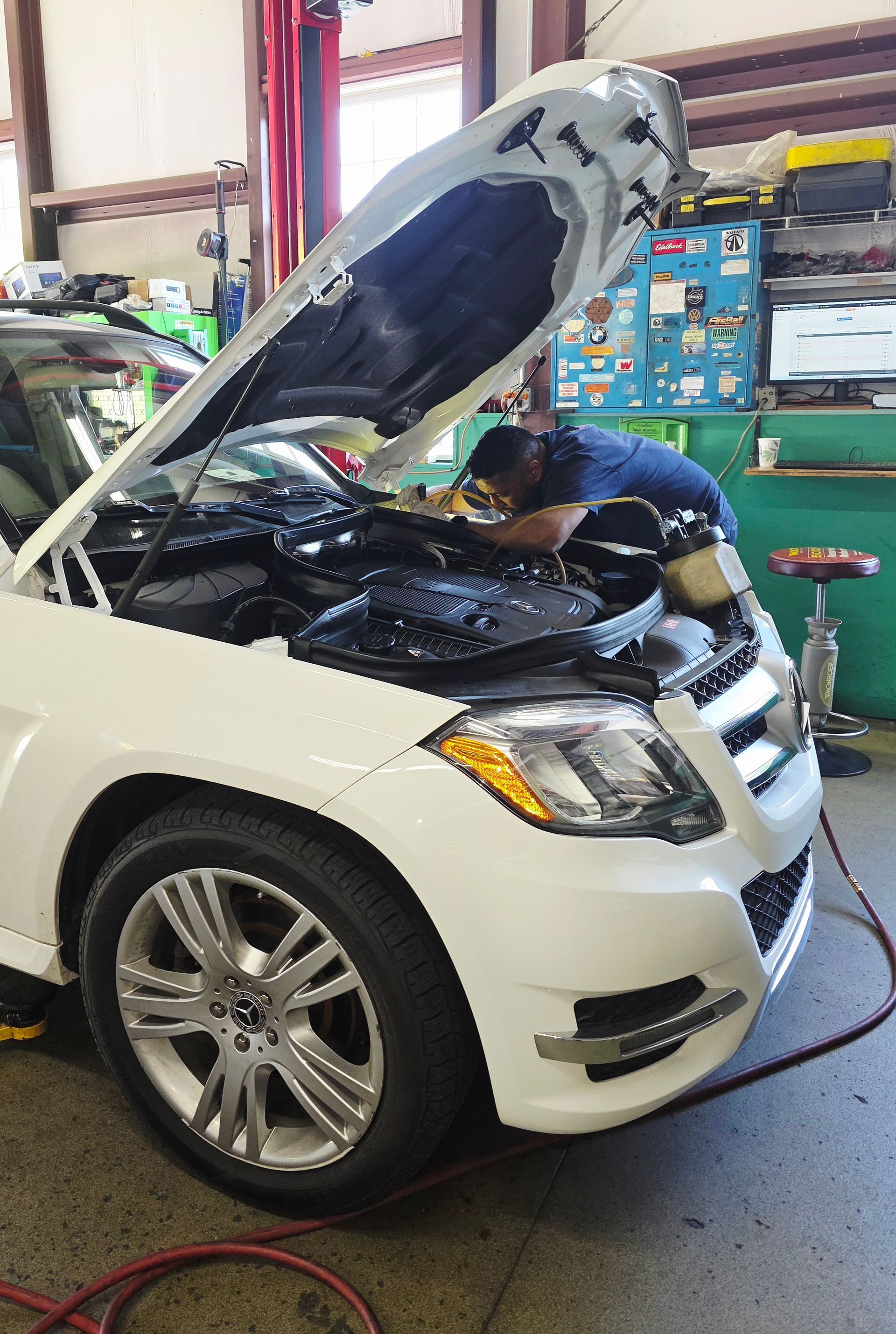 Shop's Auto Technician Working on A Car | Joe's Garage Inc.