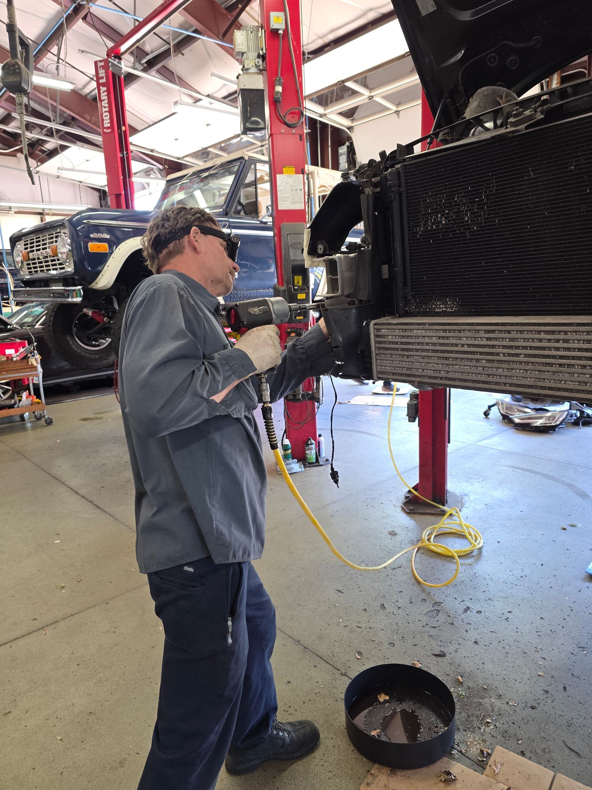 Shop's Auto Technician Working | Joe's Garage Inc.