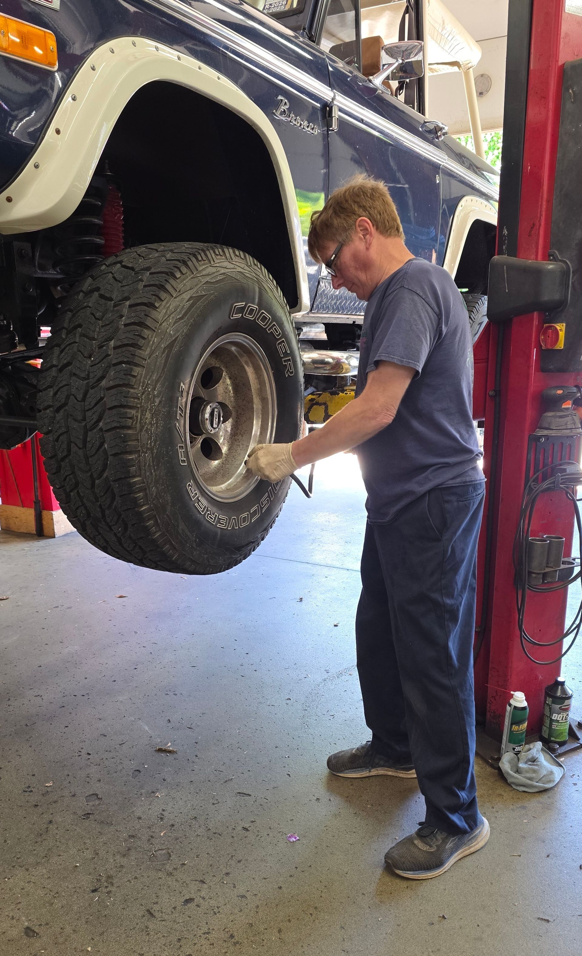 Mechanics Working on a Vehicle's Tires | Joe’s Garage Inc.