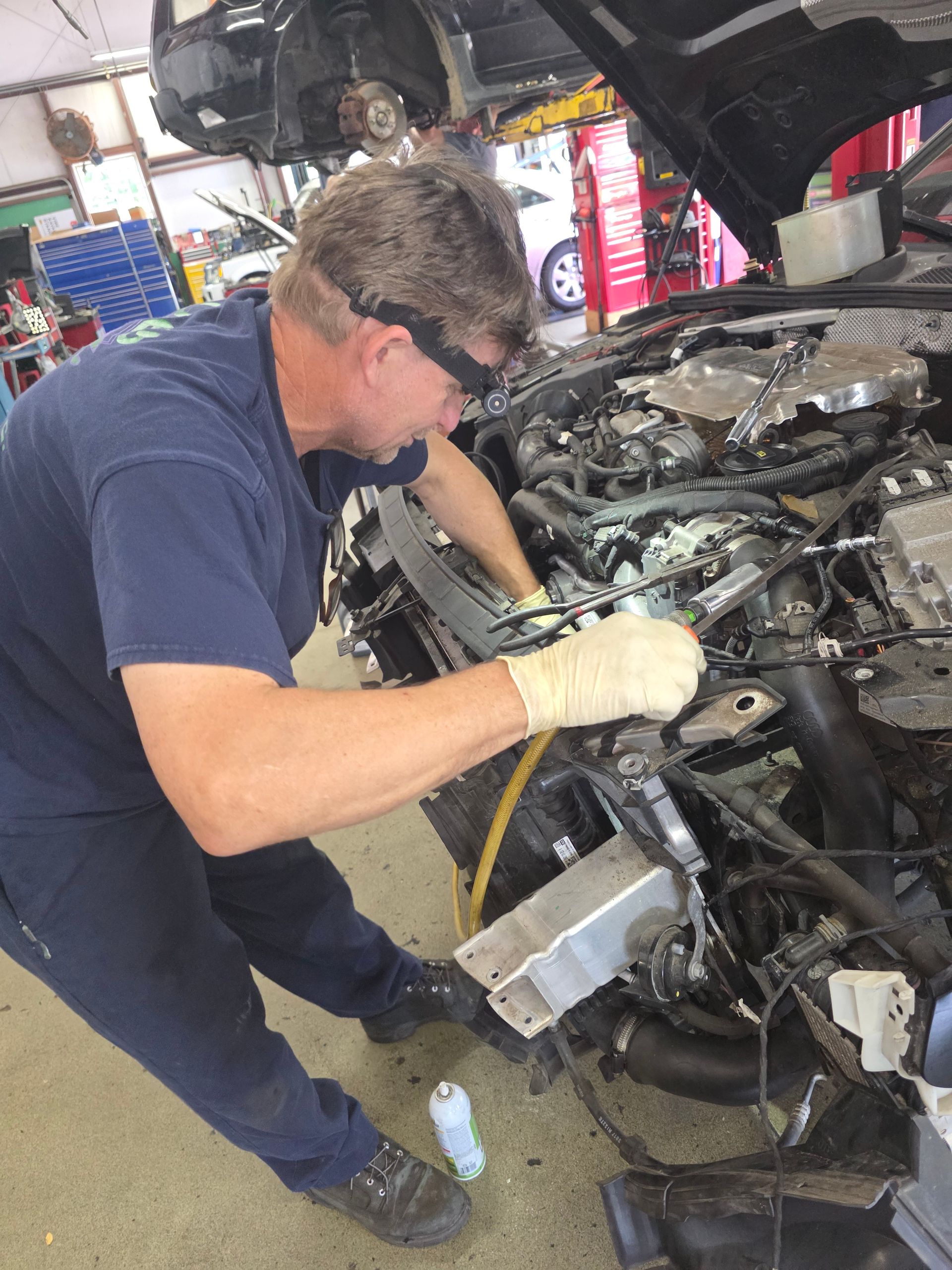 Shop's Auto Technician Working | Joe's Garage Inc.