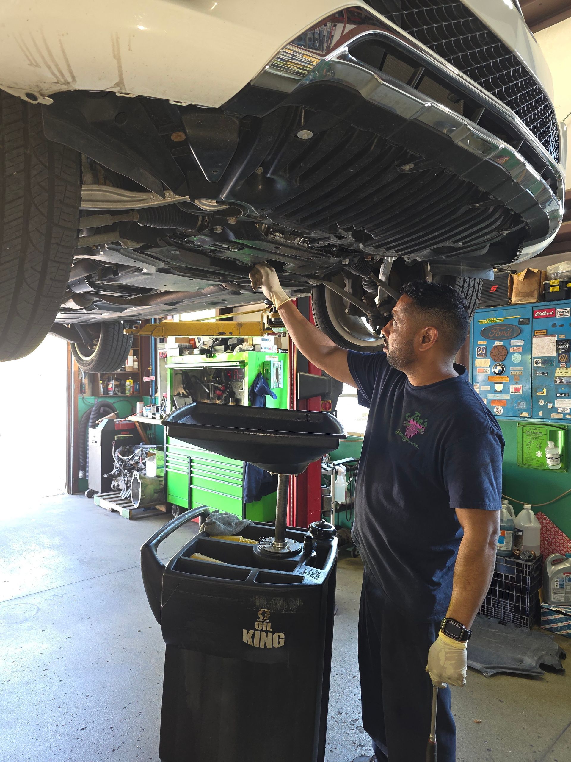 Shop's Auto Technician Working | Joe's Garage Inc.