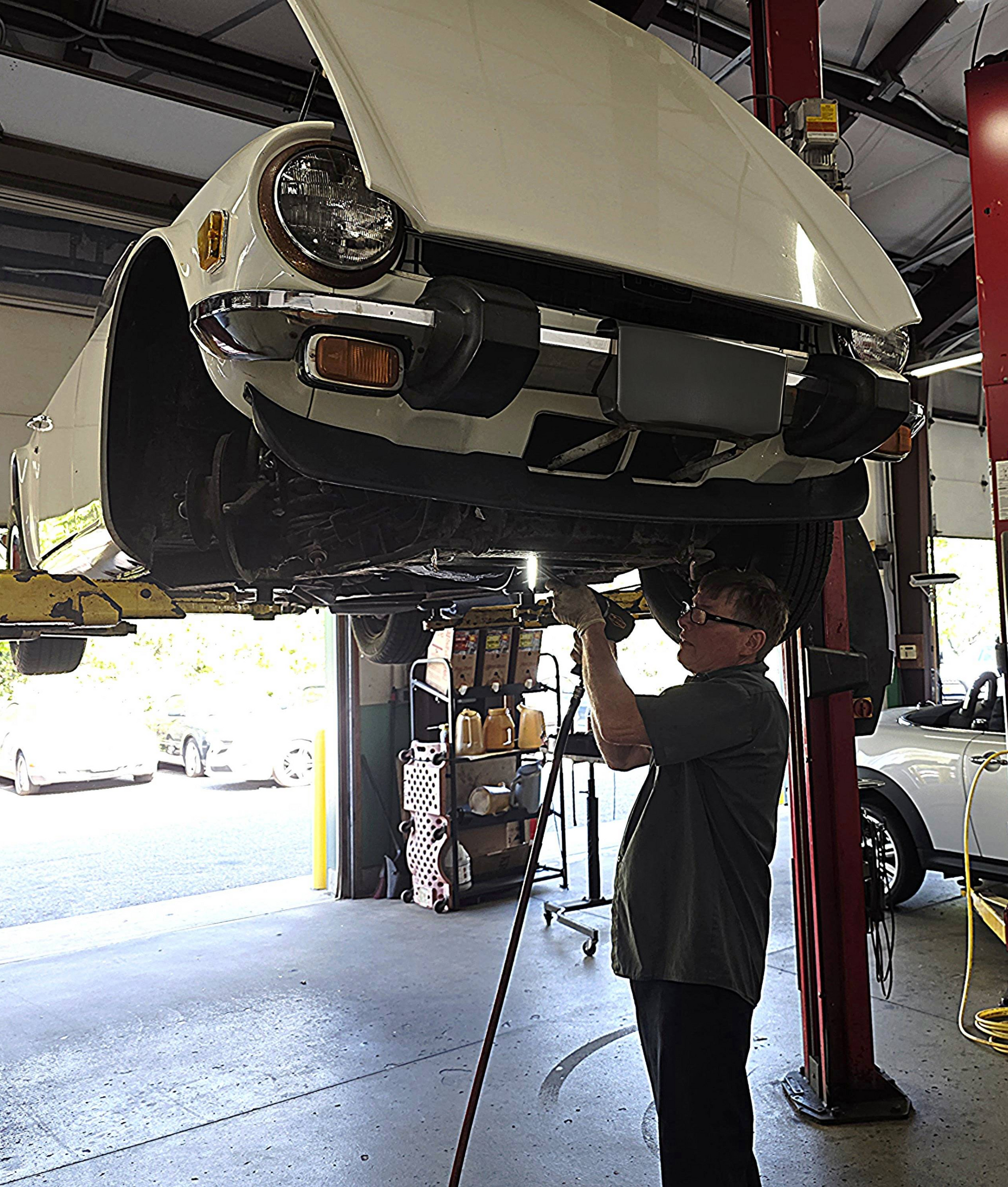 Shop's Auto Technician Working | Joe's Garage Inc.