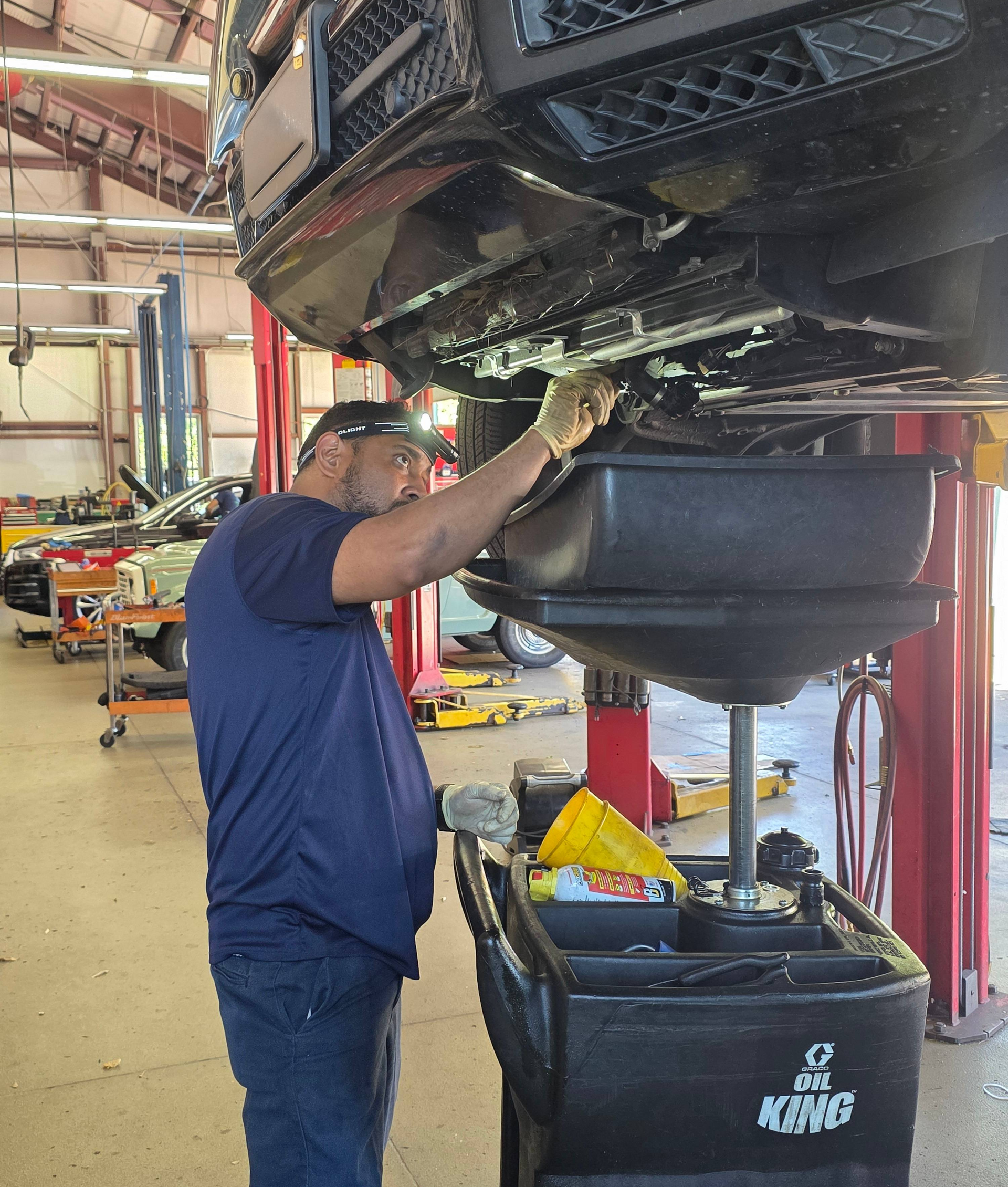 Shop's Auto Technician Working | Joe's Garage Inc.