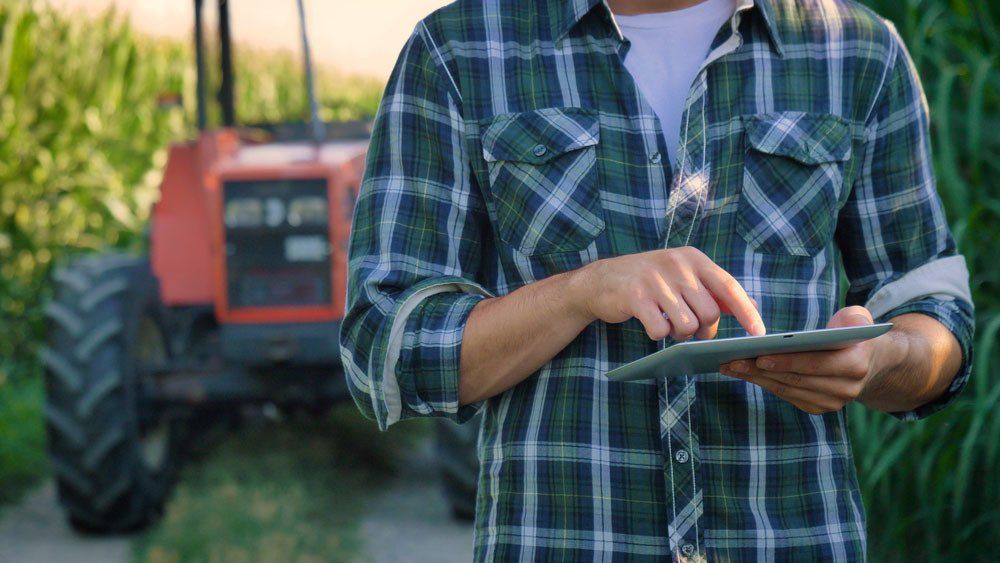 Person Using Irrigation Controller — Irrigation Supplies in Yeppoon, QLD