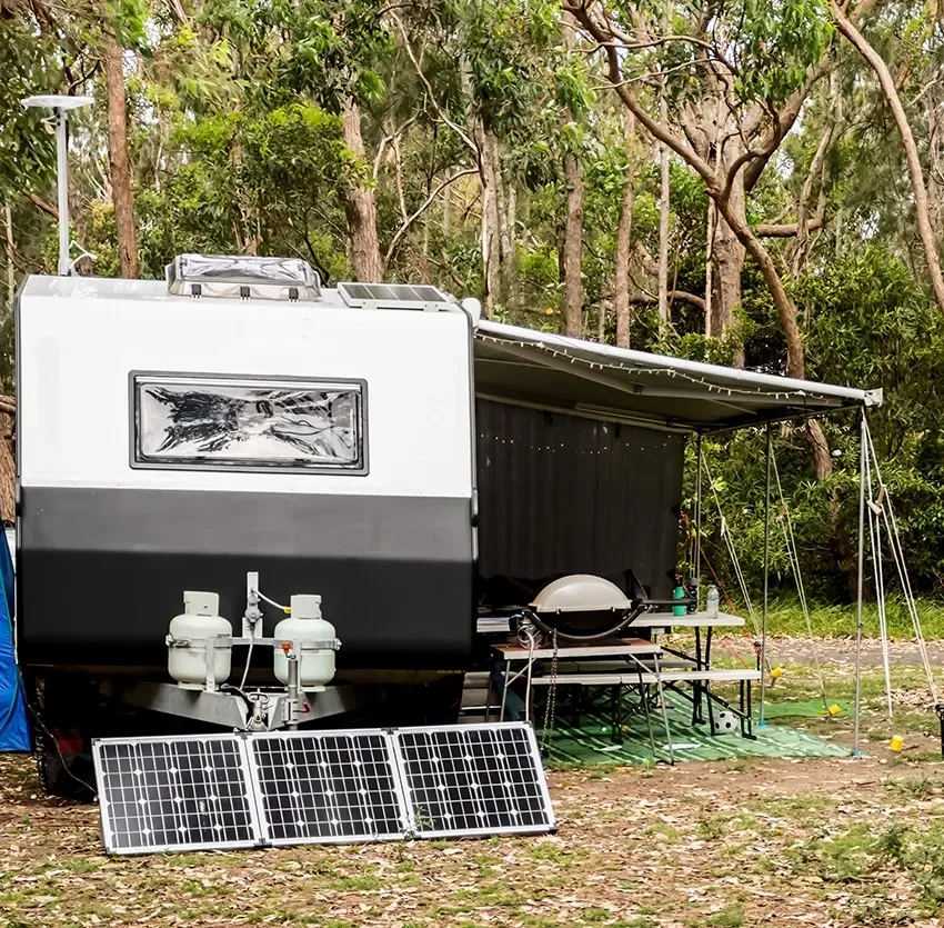 Caravan Camping Set up with Solar Panels and gas Bottles — Auto Marvel in Townsville, QLD