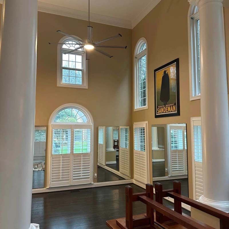 A large room with a picture of a man on the wall