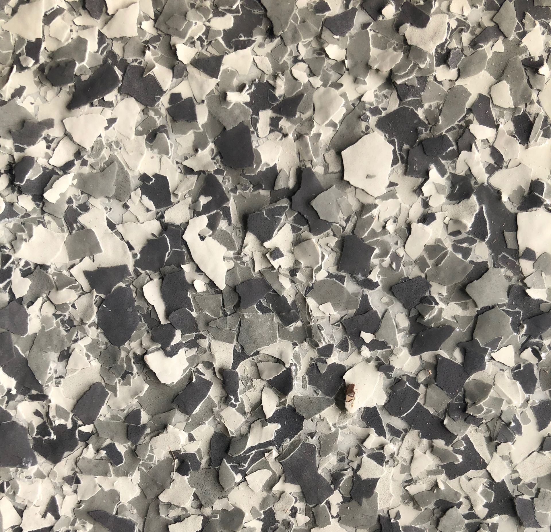 Gray, white, and black floor epoxy chips.