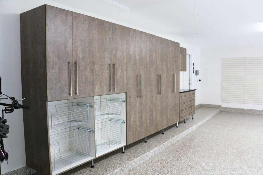 Garage cabinets with closed and open doors, providing storage space.