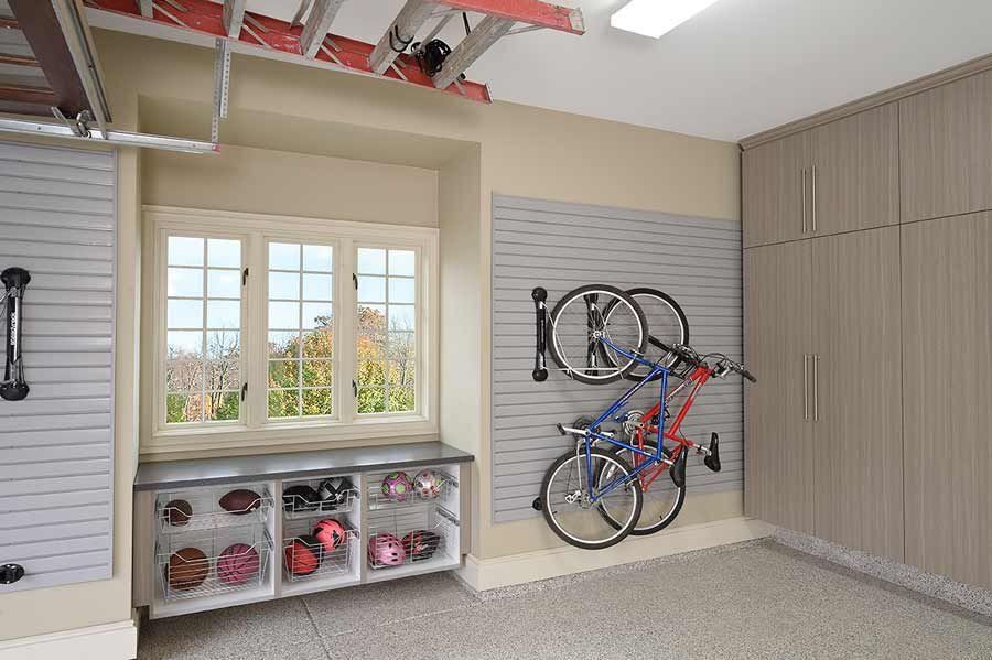 Garage interior with organized storage, bikes, and window.