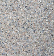 Textured surface with light and medium gray chips embedded in a beige background.