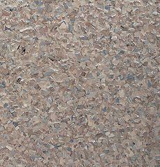 Textured flooring with light brown and gray chips.