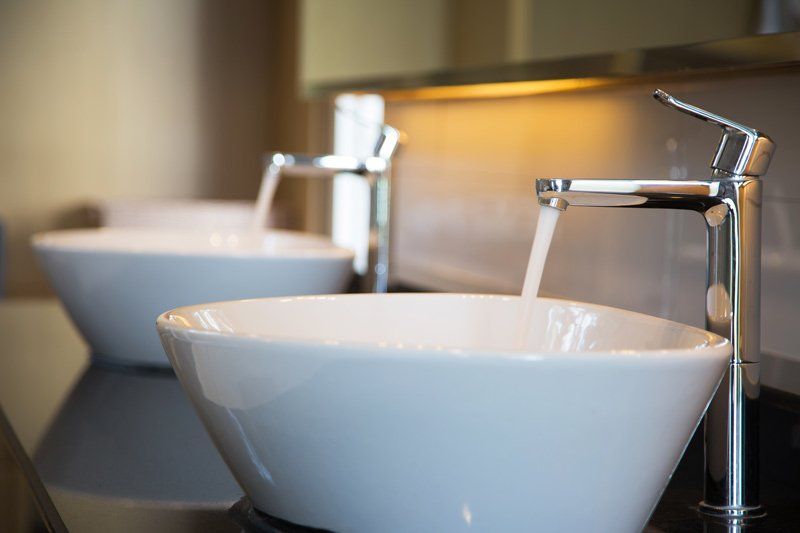 Running Water From Taps into Two Bathroom Sinks — Dempsey Plumbing in Woy Woy