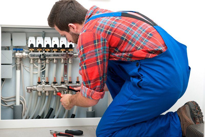 Plumber Servicing The Underfloor Heating — Dempsey Plumbing North Gosford NSW
