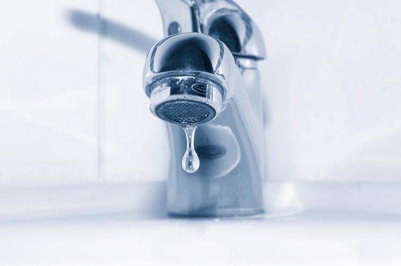 Faucet With Water Drop Close up — Dempsey Plumbing in Woy Woy