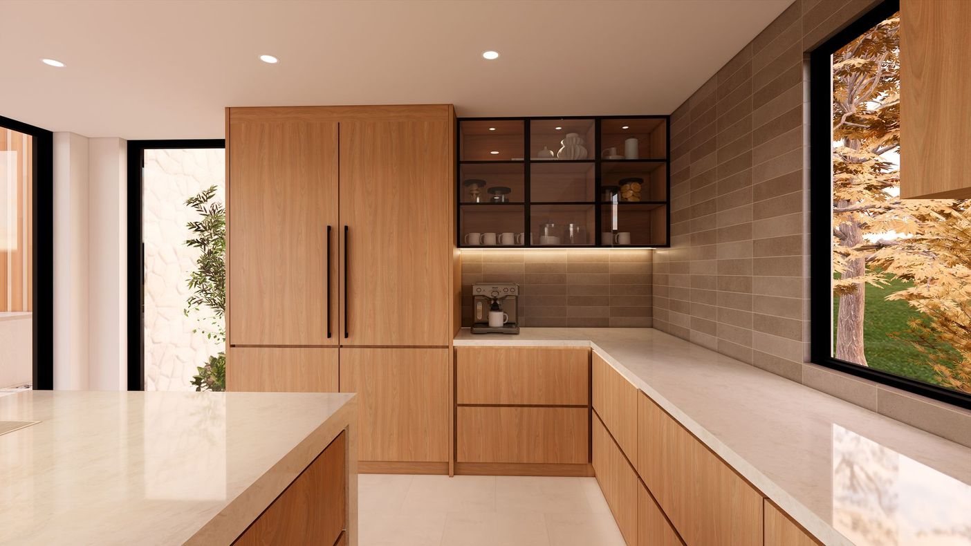 Modern minimalist kitchen with light wood cabinets, white countertops, and a large window view.