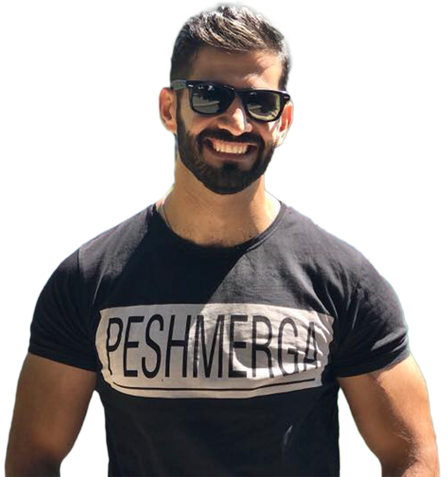 A man with a beard wearing sunglasses and a black shirt that says peshmerga