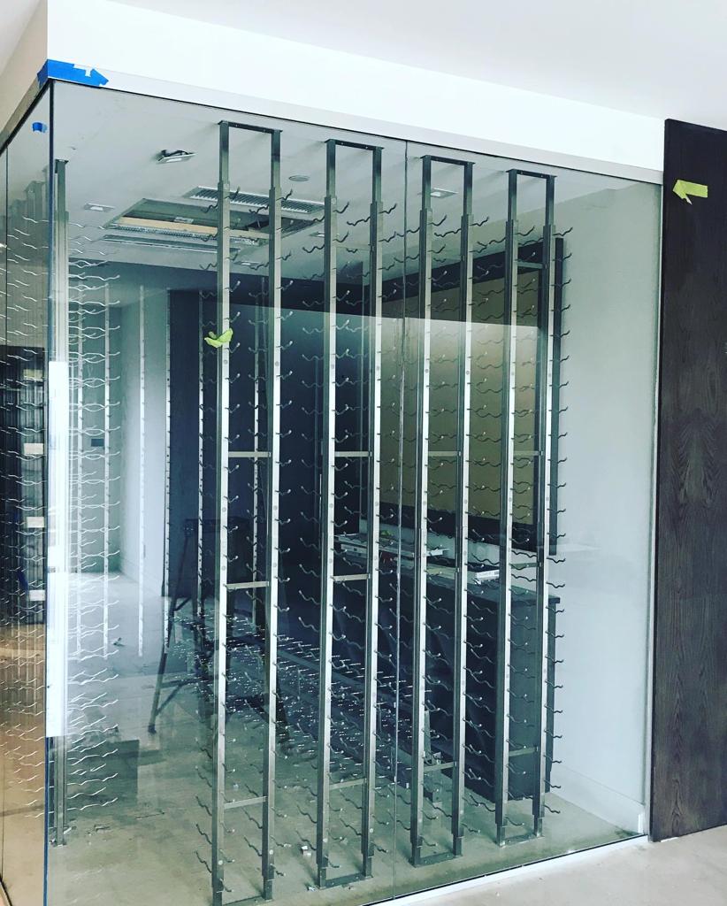 A room with a glass wall and a ladder in it