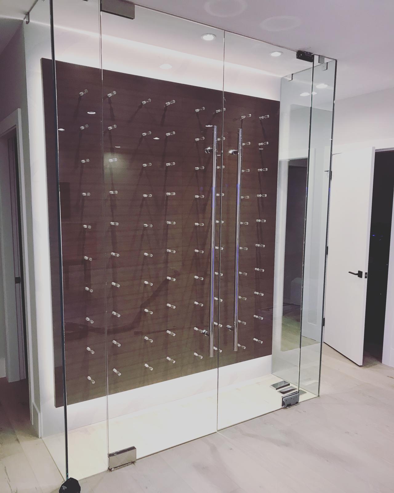 A glass door with a wooden wall behind it