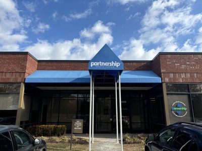 Building exterior with blue awning, 