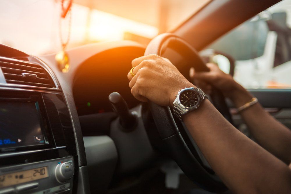 Hand Man Wear Watch And Drive A Car — Driving Lessons In Ipswich, QLD