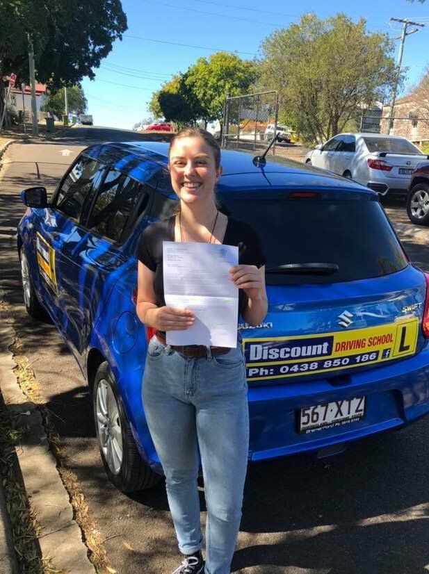 Female Student Driver Holding A Certificate — Driving Lessons In Ipswich, QLD