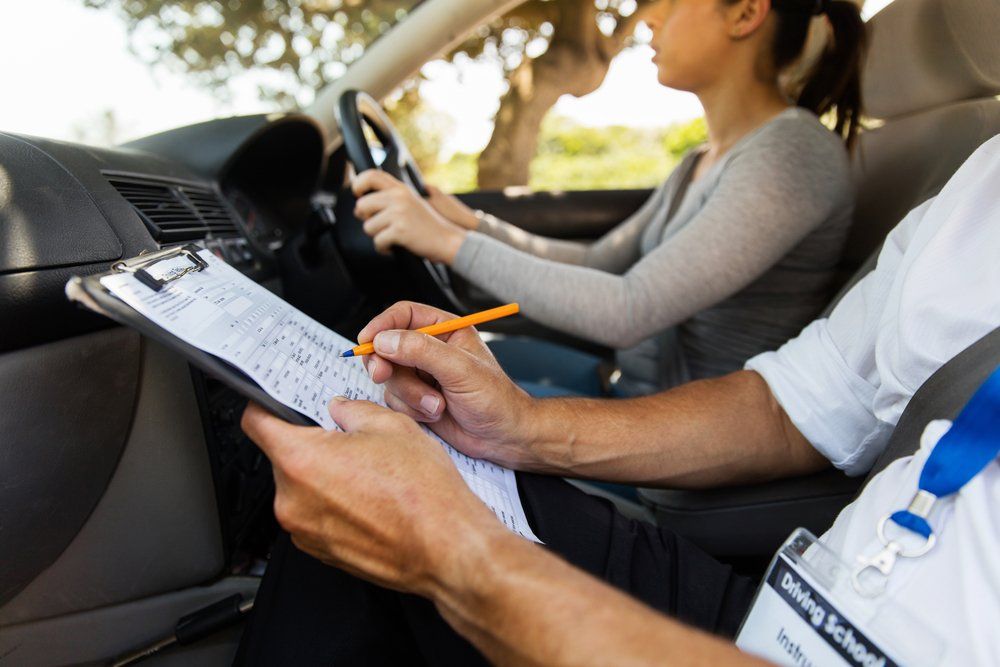 Driving Instructor Inside A Car With Student Driver — Driving Lessons In Ipswich, QLD