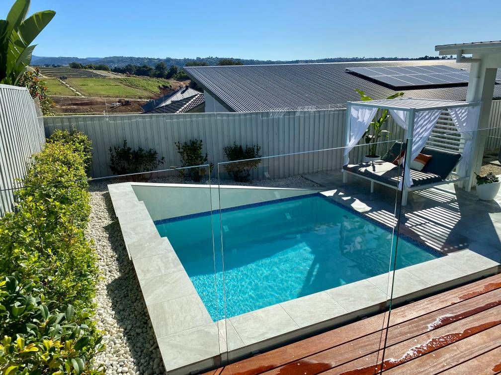 Small Backyard Pool With a Cabana and Wooden Deck — Banora Pools in Kingscliff, NSW