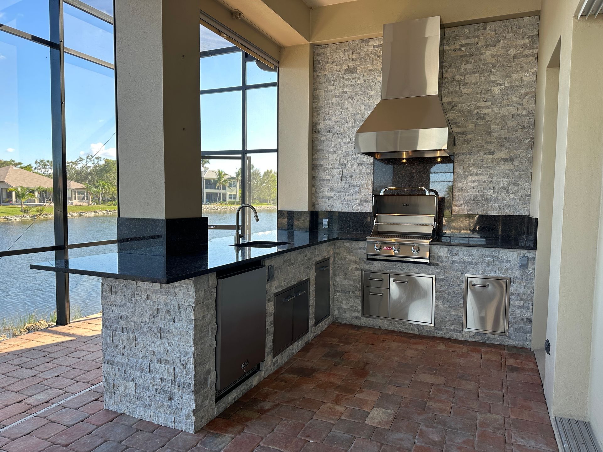L Shape Outdoor Kitchen, Granite countertopand, Delta Heat Grill, Delta Heat Inserts, Fridge, Sink, Storage, Cape Coral FL