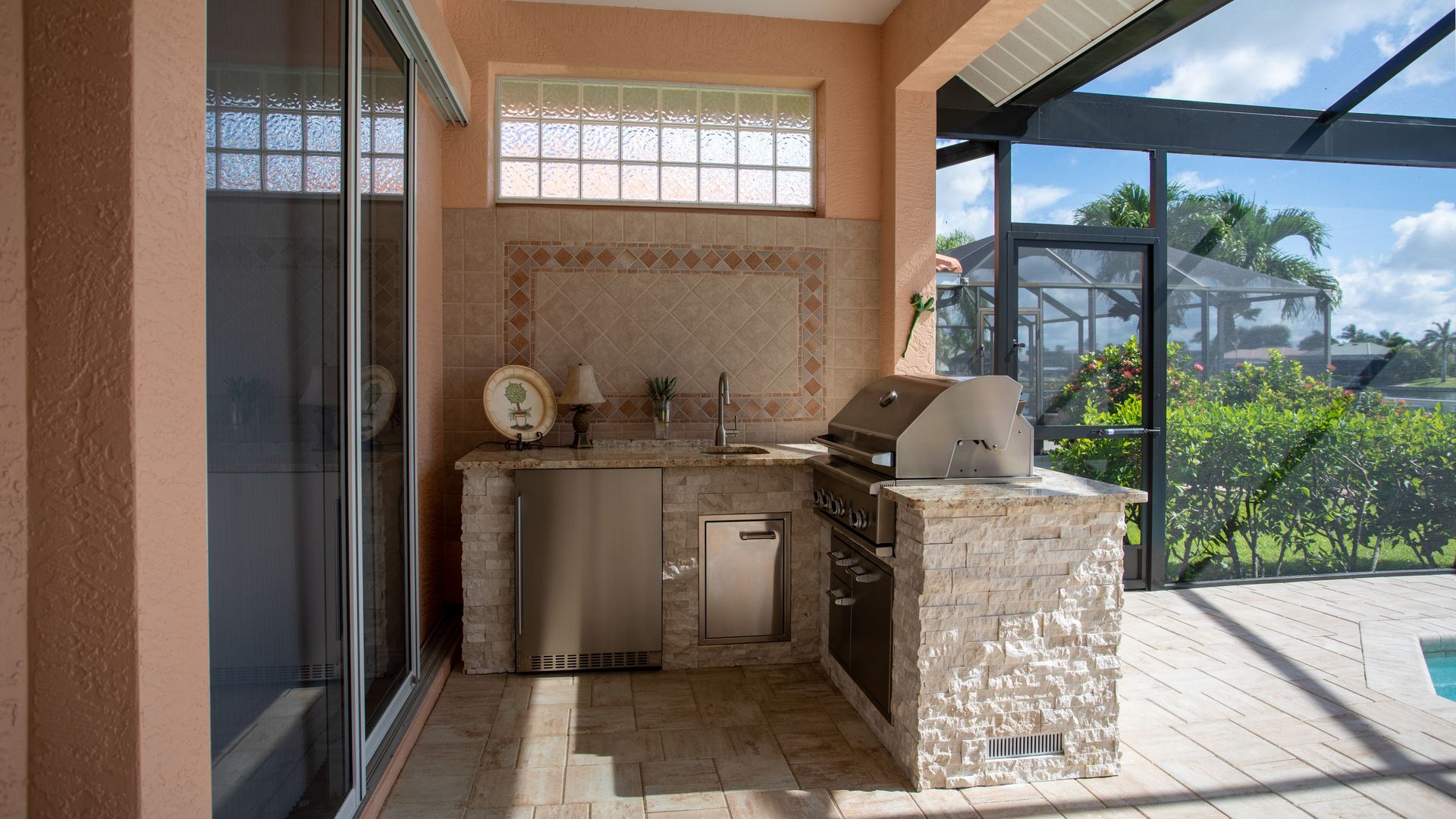 L Shape Outdoor Kitchen, Granite countertop, Delta Heat Grill, Delta Heat Inserts, Fridge, Sink, Storage, Cape Coral FL