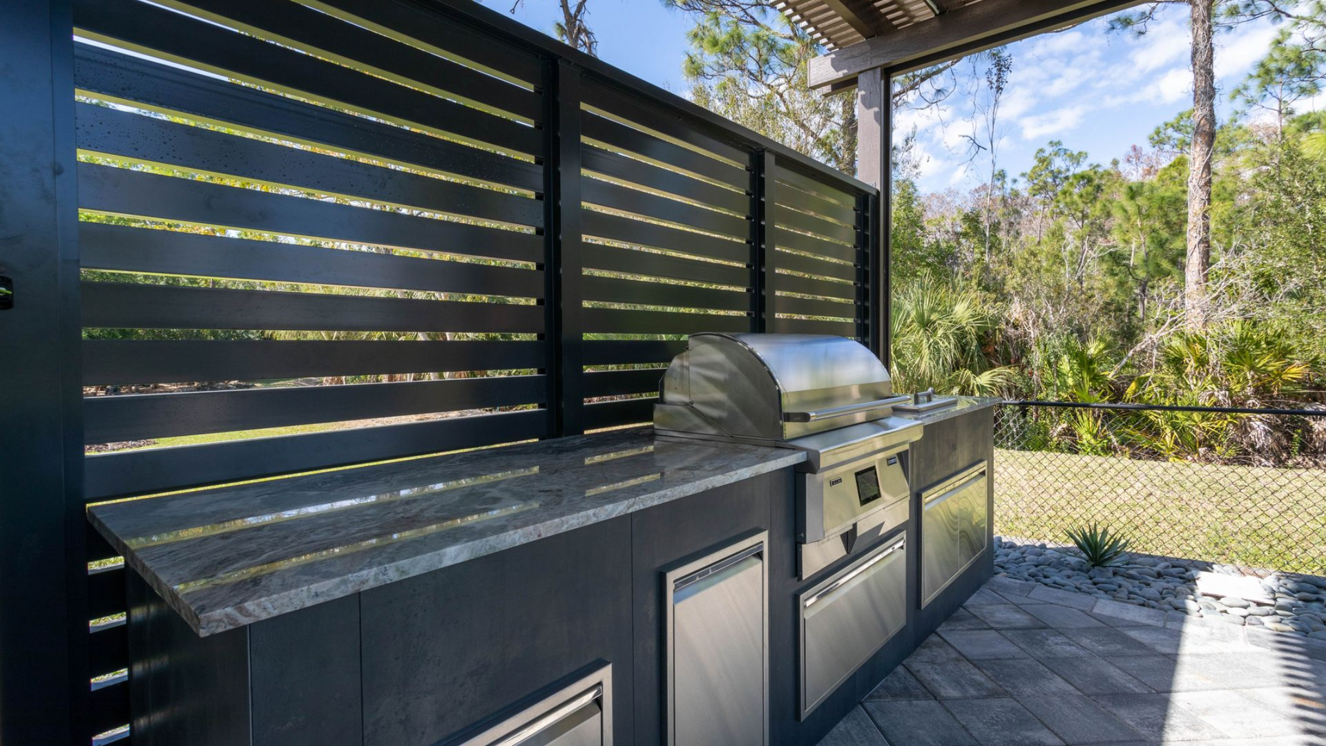 Coyote pellet grill outdoor kitchen and aluminum pergola Fort Myers FL