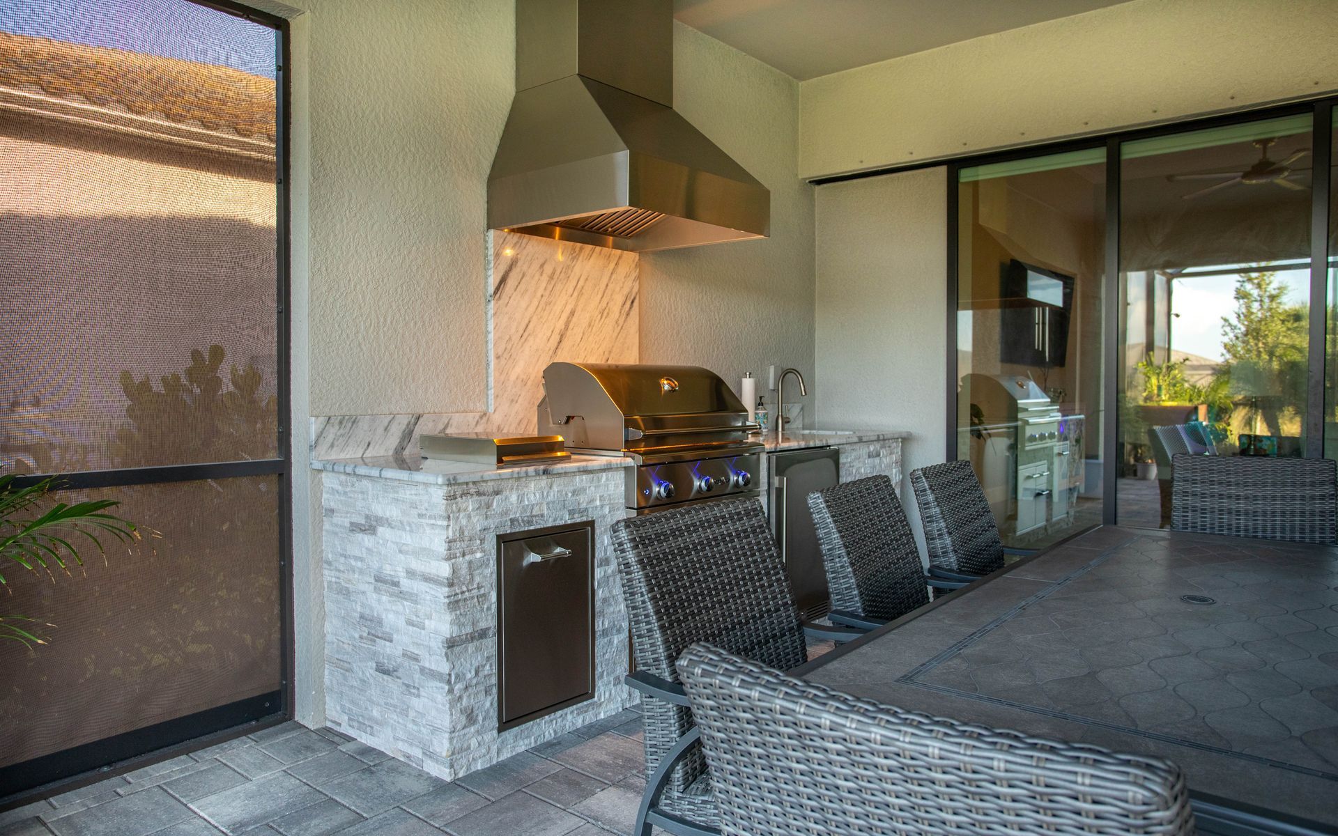 Straight run Stacked Stone Outdoor Kitchen Delta Heat Grill Tradewind Hood Estero, FL