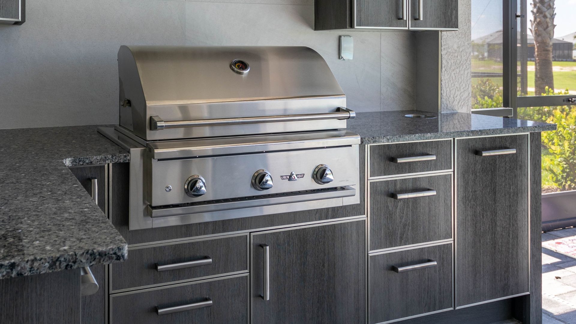 Delta Heat grill with insulating jacket NatureKast cabinetry outdoor kitchen Estero FL