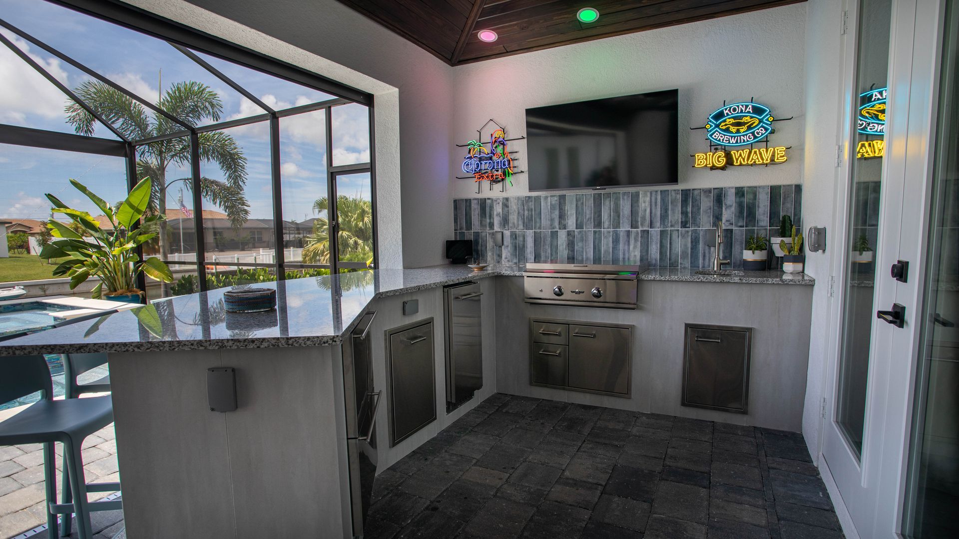 L Shape Outdoor Kitchen, Granite countertop, Tile backsplash, Delta Heat Grill, Delta Heat Inserts, Cape Coral FL