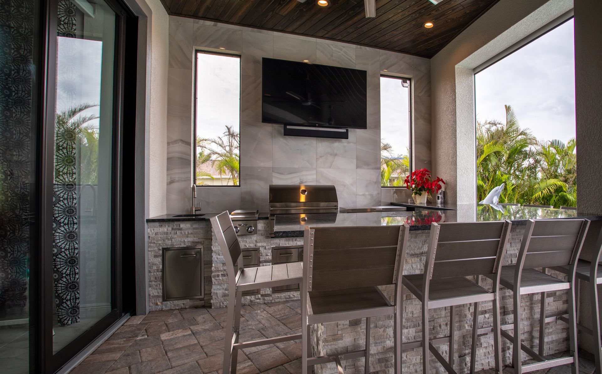 Large U shape outdoor kitchen , seating area, Tile, stacked stone, tan and brown, sleek, modern, custom, Valencia Trails